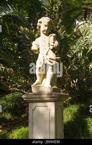 A statue of a small boy or cherub at Monte Palace Tropical Garden, Funchal, Madeira Stock Photo