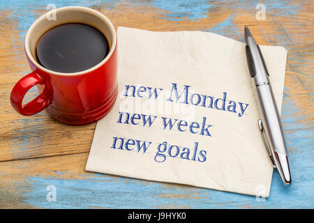 New Monday, new week, new goals - handwriting on a napkin with a cup of coffee Stock Photo