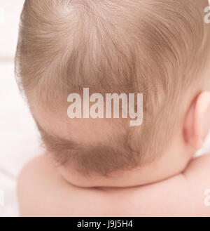 close up of baby bald patch Stock Photo