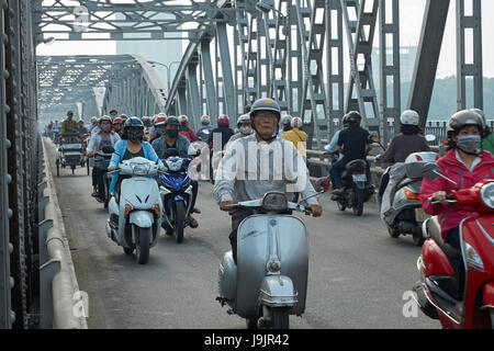 Motorcycles on Trang Tien Bridge across Perfume River, Hue, North Central Coast, Vietnam Stock Photo