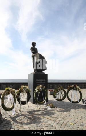 Memorial located in Urk, Netherlands, a tribute to all the men who perished at sea. The plaques on the wall lists the men in the year they were lost. Stock Photo