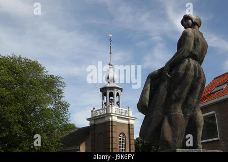 Memorial located in Urk, Netherlands, a tribute to all the men who perished at sea. The plaques on the wall lists the men in the year they were lost. Stock Photo