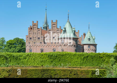 Egeskov castle in Denmark behind hedge Stock Photo