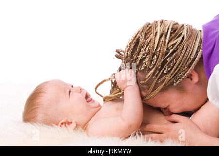 Mother playing with baby both laughing isolated on white Stock Photo