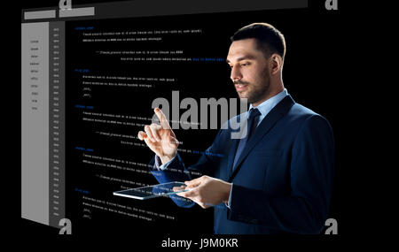 businessman with tablet pc and virtual coding Stock Photo - Alamy