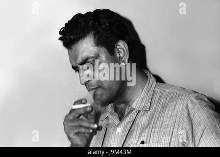 Satyajit Ray, Indian filmmaker, screenwriter, documentary filmmaker, author, essayist, lyricist, magazine editor, illustrator, calligrapher, music composer, smoking, India, Asia, Asian, Indian Stock Photo