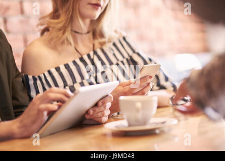 Modern couple using wireless technology Stock Photo