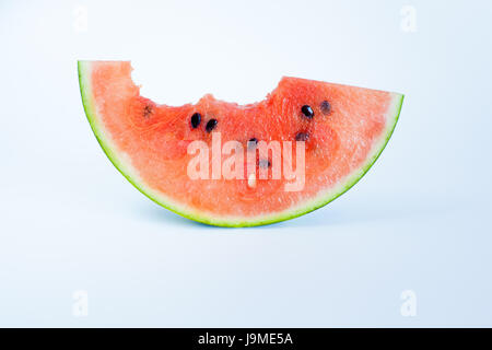 bitten watermelon slice on a white background. Stock Photo