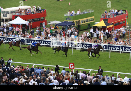 Highland Reel ridden by jockey Ryan Moore (right) on the way to winning the Investec Coronation Cup on Ladies Day during the 2017 Investec Epsom Derby Festival at Epsom Racecourse, Epsom. Stock Photo