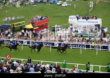 Highland Reel ridden by jockey Ryan Moore (right) on the way to winning the Investec Coronation Cup on Ladies Day during the 2017 Investec Epsom Derby Festival at Epsom Racecourse, Epsom. Stock Photo