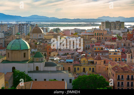 Cagliari Sardinia cityscape, view of the city's Stampace old town district at dusk with the Sant'Anna church in the foreground, Sardinia Stock Photo