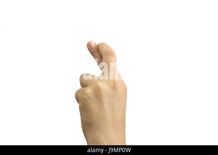 Children's hand at which fingers are crossed by a dagger isolated on white background. Hand with crossed fingers, symbol fingers crossed child hand. Stock Photo