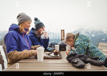 Family having breakfast during winter Stock Photo