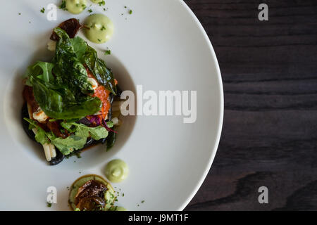 Close up of meal served in plate on table in restaurant Stock Photo
