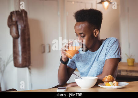 Man having breakfast at home Stock Photo