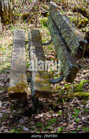 The side view of a moss covered bench. Stock Photo