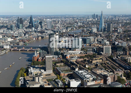 An aerial view from Waterloo Bridge at the South Bank of the River Thames looking across the city towards Canary Wharf. Stock Photo