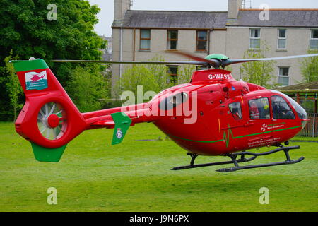 Eurocopter EC135 T2,Wales Air Ambulance G-WASS, at Holyhead School Stock Photo