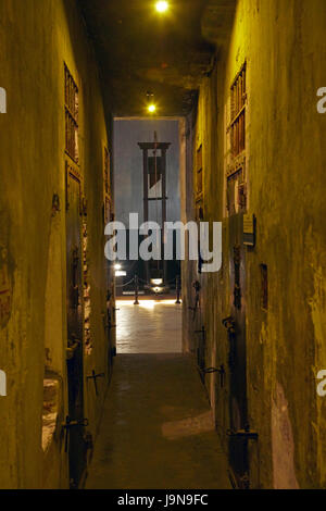 Cell block corridor and historic guillotine, Hoa Lo Prison Museum, (Aka Hanoi Hilton), Hanoi, Vietnam Stock Photo