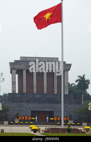 Vietnamese flag and Ho Chi Minh's Mausoleum, Ba Dinh Square, Hanoi, Vietnam Stock Photo