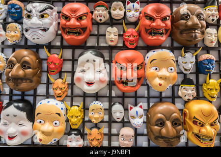 Mix Japan traditional mask culture on wall. Stock Photo