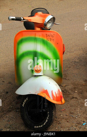 A scooter painted in Indian national flag tricolor pattern showing patriotism Stock Photo