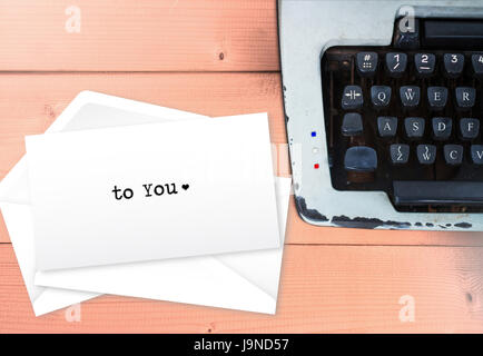 To you, love letter text on envelop stack letters with vintage typewriter Stock Photo