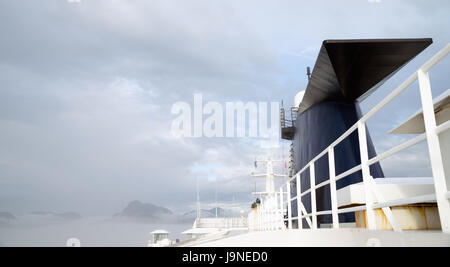 A ship steams along the inside passage Pacific Ocean Stock Photo