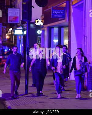 People run down Borough High Street as police are dealing with a 'major incident' at London Bridge. Stock Photo