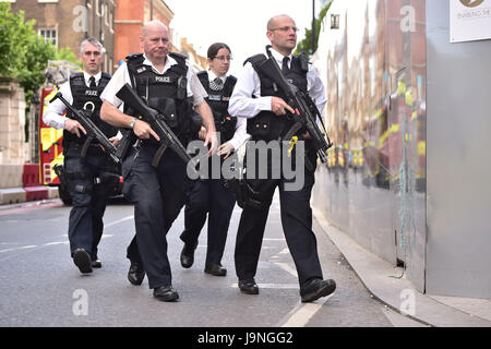 Armed police on St Thomas Street, London, near the scene of last night's terrorist incident at Borough Market. Stock Photo