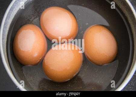 Eggs in a pan Stock Photo