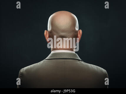 The back of a bald man in suit Stock Photo