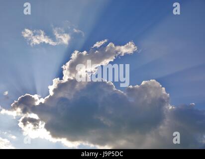 Rays of light shining through clouds Stock Photo