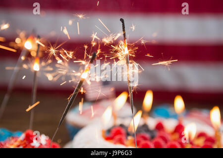 Patriotic 4th of july cake and cupcake arranged on wooden table Stock Photo