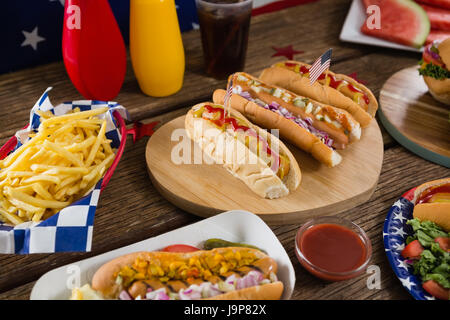 Close-up of hot dogs on wooden table with 4th july theme Stock Photo