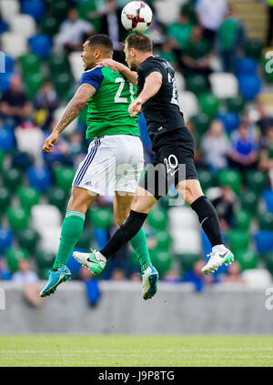 Northern Ireland's Josh Magennis in action against New Zealand's Tommy Smith during the international friendly match at Windsor Park, Belfast. Stock Photo