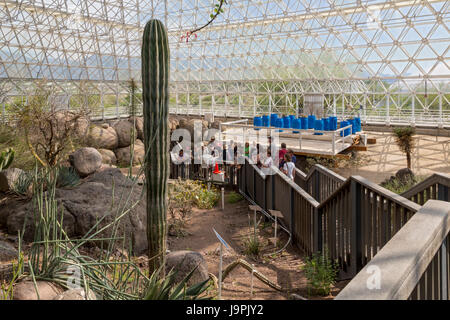 Oracle, Arizona - Visitors tour the desert environment in Biosphere2. People lived in the sealed Biosphere2 for as long as two years in the early 90s  Stock Photo