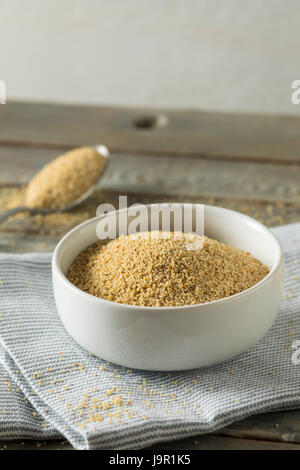 Raw Organic White Poppy Seeds in a Bowl Stock Photo