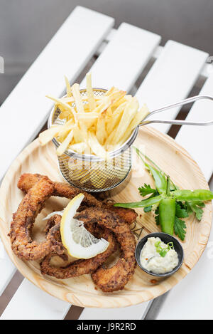 fried octpus seafood rings calamari style with fries tapas snack set Stock Photo