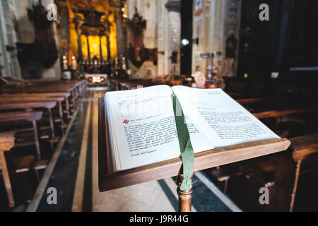 Varallo, Italy, May 24 2017: An opened bible book in a church Stock Photo