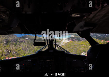 A scary approach and landing from a small plane on the runway of the airport on the island of St. Barts in the French West Indies Stock Photo
