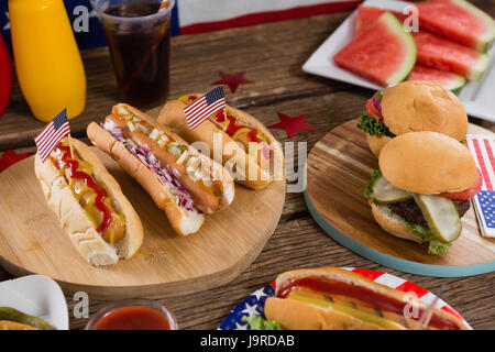 Close-up of hot dogs on wooden table with 4th july theme Stock Photo