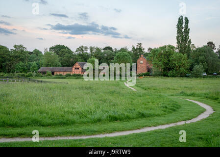 A view of Forge Mill Needle Museum across a field Stock Photo