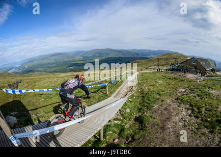 Fort William, Scotland, UK 3rd June 2017 UK Weather: The UCI Mountain Bike World Cup at Fort William gets underway with blue skies, although heavy rain is forcast for later in the day. Credit Reuben Tabner/Alamy Live News Stock Photo