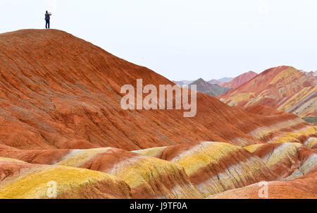 Zhangye, China's Gansu Province. 3rd June, 2017. Tourists visit the Danxia National Geological Park in Zhangye City, northwest China's Gansu Province, June 3, 2017. Credit: Wang Jiang/Xinhua/Alamy Live News Stock Photo