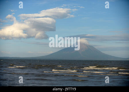 El Ometepe Volcano rises out of the waves of Lake Nicaragua. Stock Photo