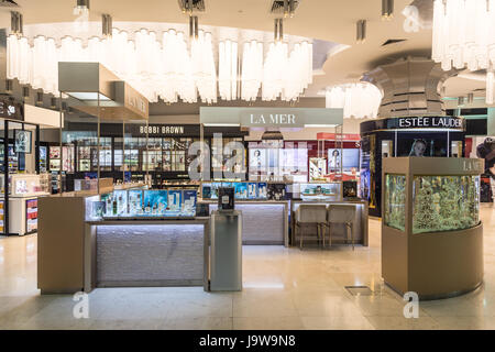 KUALA LUMPUR, MALAYSIA - MAY 19, 2017: Duty free beauty products such as make up and perfumes are displayed in a shop in the airport terminal building Stock Photo