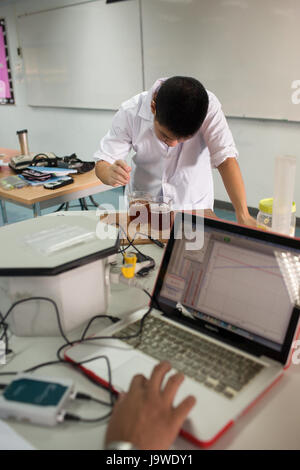 Bangkok, Thailand - November 22, 2012 : In a college in Bangkok, students study chemistry and science in the university's laboratory Stock Photo