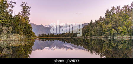 Sunset, Mirror Island, Mt. Tasman and Mt. Cook, Reflection in Lake Matheson, Mount Cook National Park, Westland National Park Stock Photo