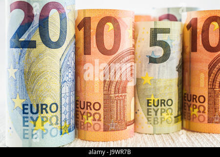 Rolled upright twenty, ten and five Euros, paper currency bank notes Stock Photo